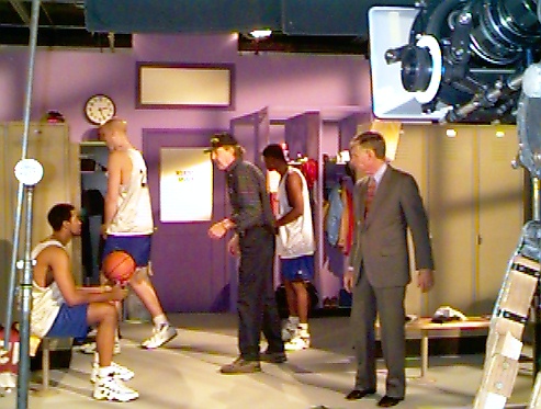 Director John Burgess giving direction to extras.